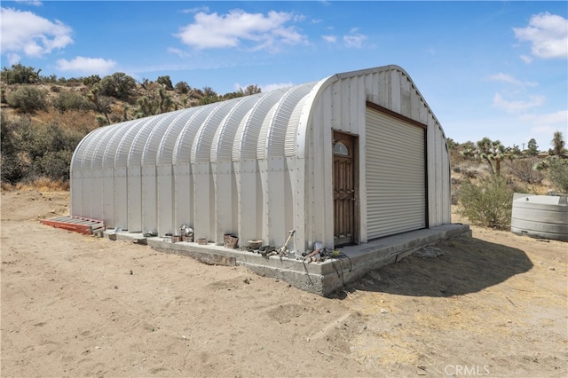 view of outdoor structure with a garage