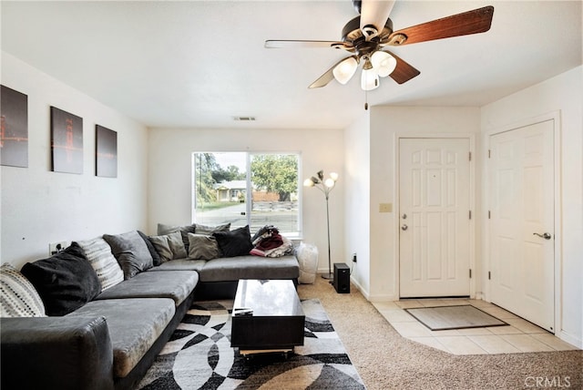 living room featuring ceiling fan and light colored carpet