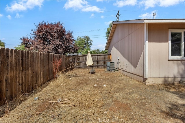 view of yard featuring central air condition unit