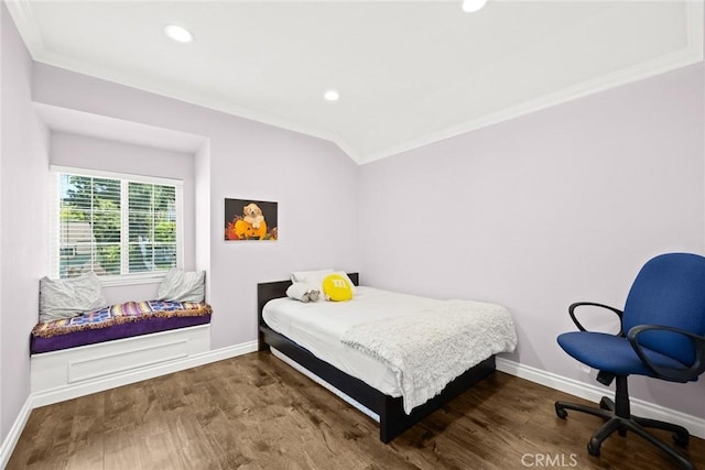 bedroom with crown molding and hardwood / wood-style flooring