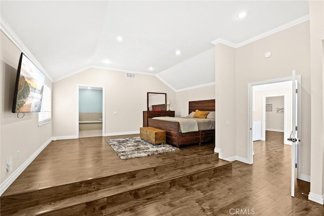 bedroom featuring dark hardwood / wood-style floors, lofted ceiling, and ornamental molding