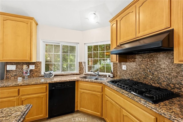 kitchen with sink, light tile patterned flooring, black appliances, and stone countertops