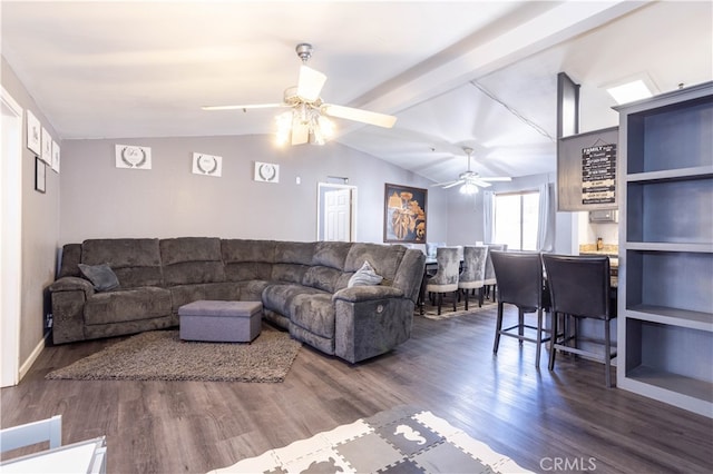 living room with vaulted ceiling with beams, dark hardwood / wood-style floors, and ceiling fan