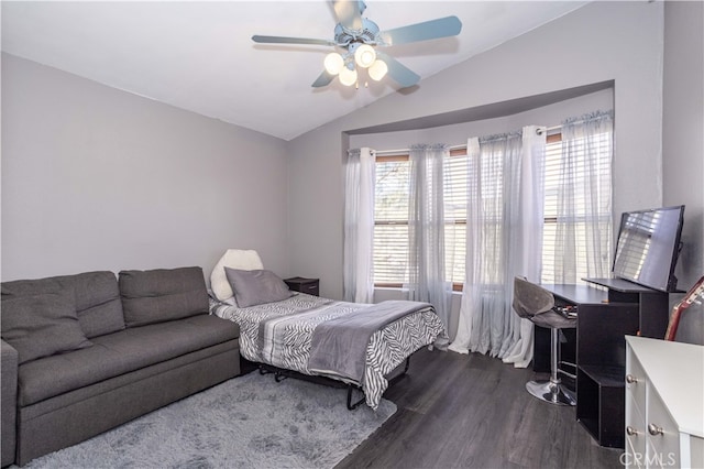 bedroom featuring lofted ceiling, multiple windows, dark hardwood / wood-style floors, and ceiling fan