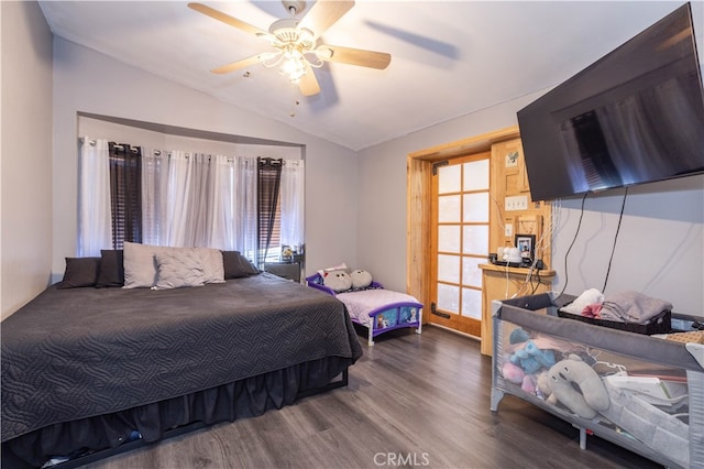 bedroom with lofted ceiling, ceiling fan, and hardwood / wood-style floors