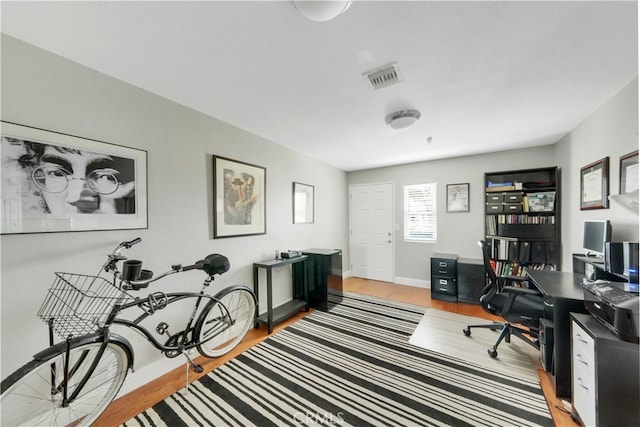 office space with light hardwood / wood-style flooring