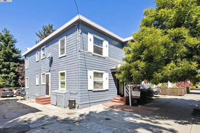 view of property exterior with a patio