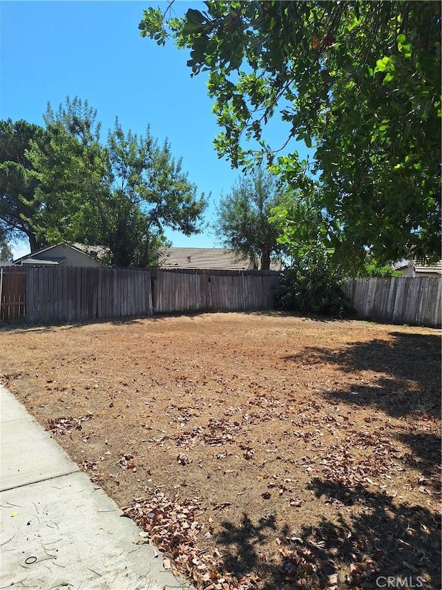 view of yard with a fenced backyard