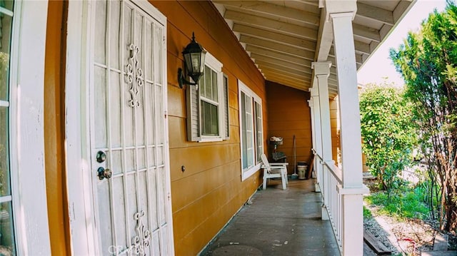 view of side of home featuring a porch