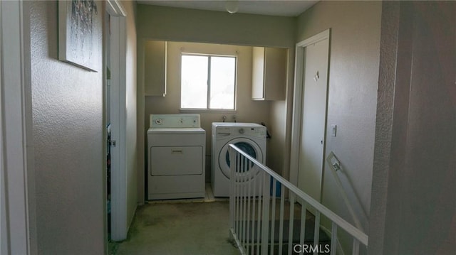 washroom with laundry area and independent washer and dryer