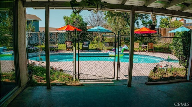 view of swimming pool featuring a fenced in pool and fence