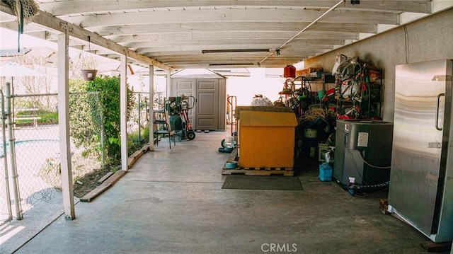 view of patio with an outbuilding and a shed