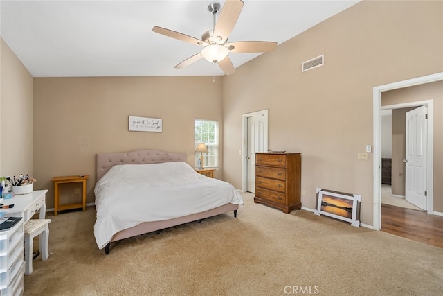 bedroom with high vaulted ceiling, ceiling fan, and carpet flooring