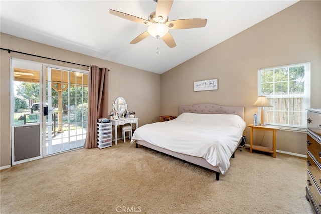 carpeted bedroom featuring vaulted ceiling, multiple windows, access to outside, and ceiling fan