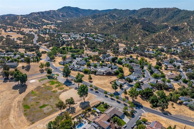 birds eye view of property with a mountain view