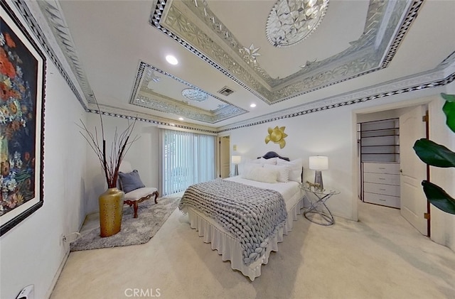 bedroom with baseboard heating, ornamental molding, a tray ceiling, and light carpet