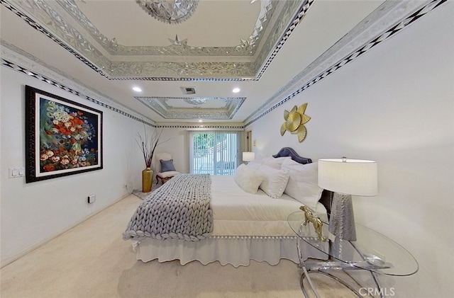 bedroom featuring a tray ceiling and ornamental molding