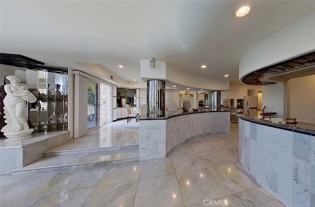 kitchen featuring dark stone counters