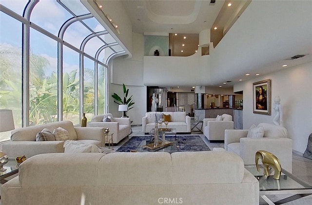 living room featuring a high ceiling