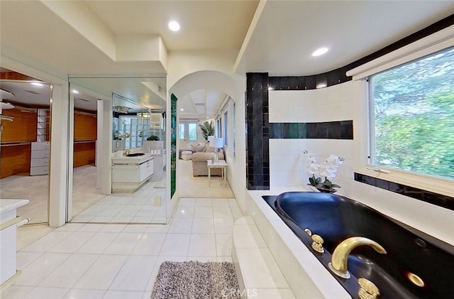 bathroom featuring vanity, tile patterned floors, and independent shower and bath