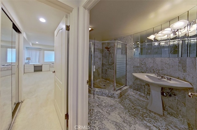 bathroom with sink and walk in shower