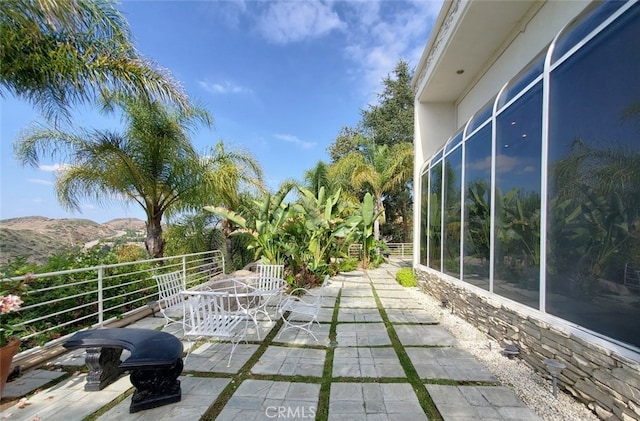 view of patio / terrace with a mountain view