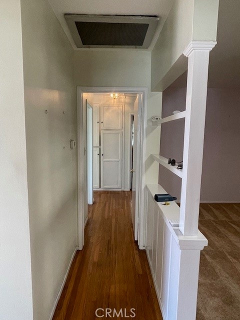 hall with dark hardwood / wood-style flooring