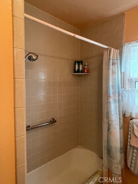 bathroom featuring shower / bath combination with curtain