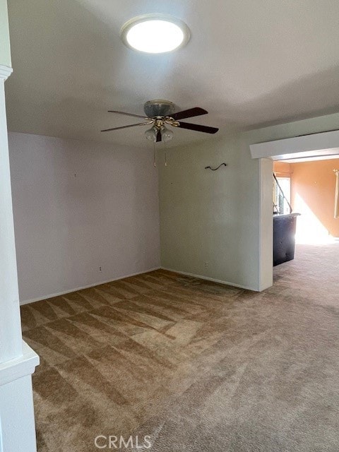 unfurnished room with carpet floors and ceiling fan