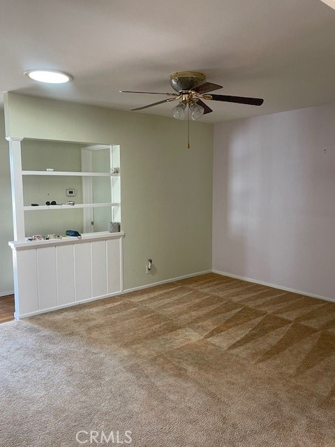 carpeted empty room with ceiling fan