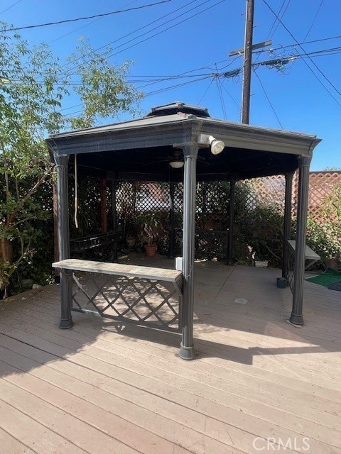 wooden deck featuring a gazebo