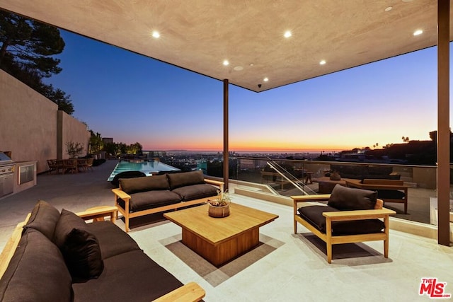 patio terrace at dusk with outdoor lounge area