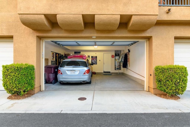 garage featuring secured water heater