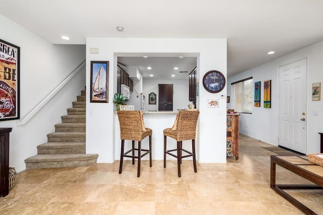 kitchen with a kitchen breakfast bar and kitchen peninsula