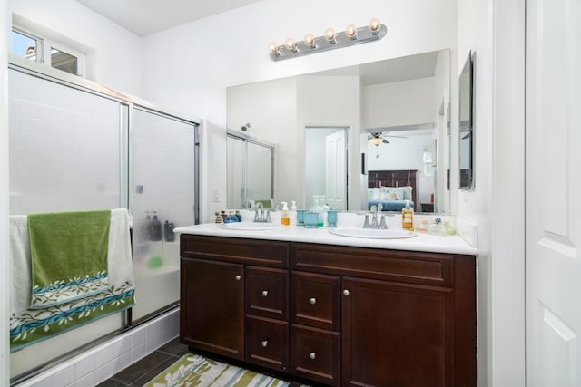 bathroom featuring vanity, a shower with door, and ceiling fan