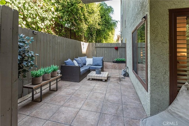 view of patio featuring a fenced backyard and an outdoor living space