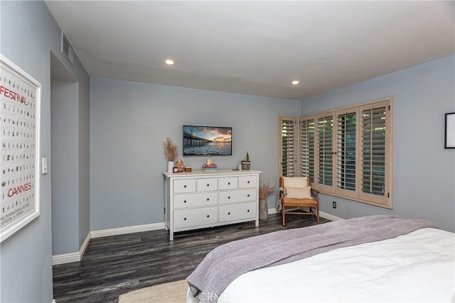 bedroom with dark wood-style flooring, recessed lighting, and baseboards