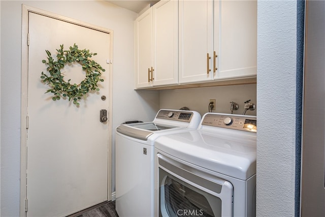 laundry area with cabinets, dark wood-type flooring, and separate washer and dryer