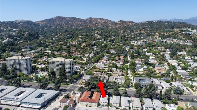 birds eye view of property featuring a mountain view