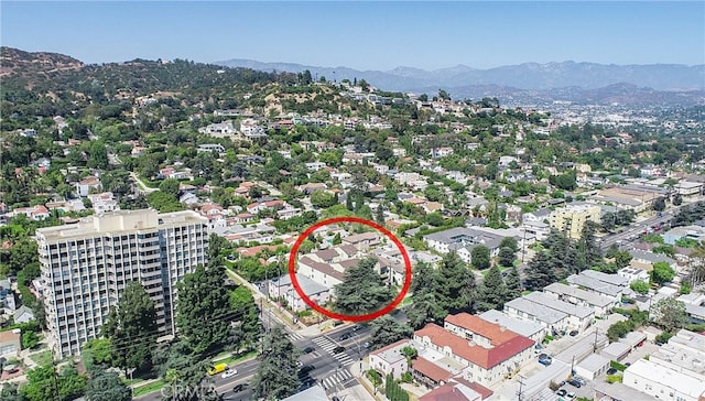 birds eye view of property with a mountain view