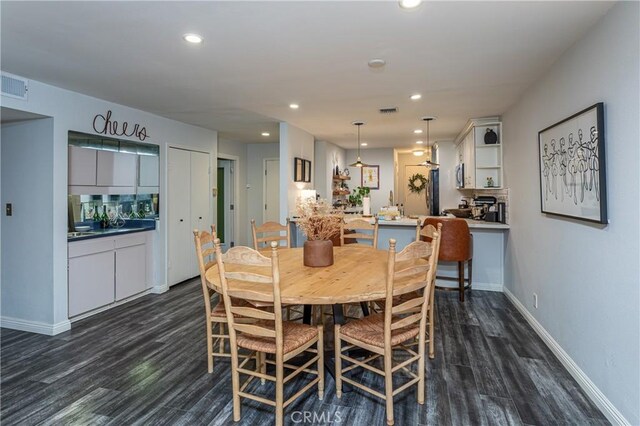 dining space with dark wood-type flooring