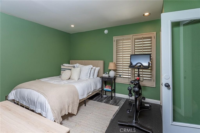 bedroom with recessed lighting, baseboards, and wood finished floors