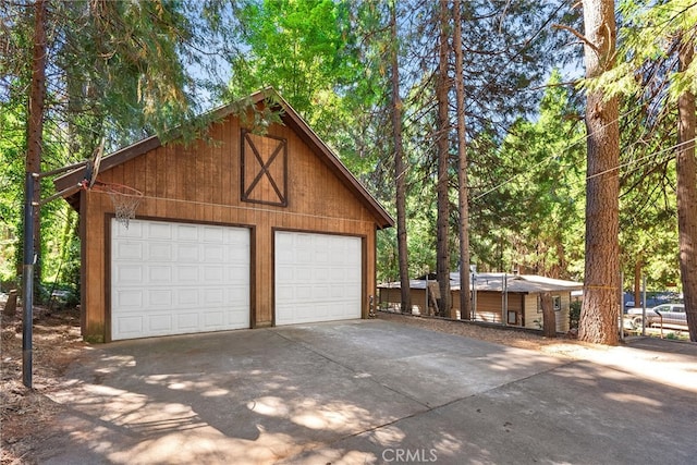 garage featuring wood walls