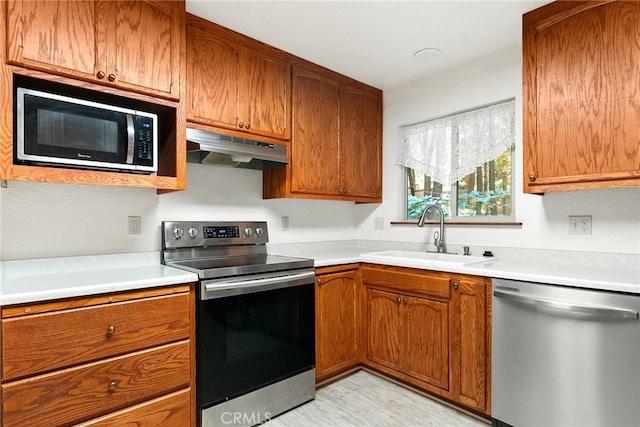 kitchen featuring appliances with stainless steel finishes and sink