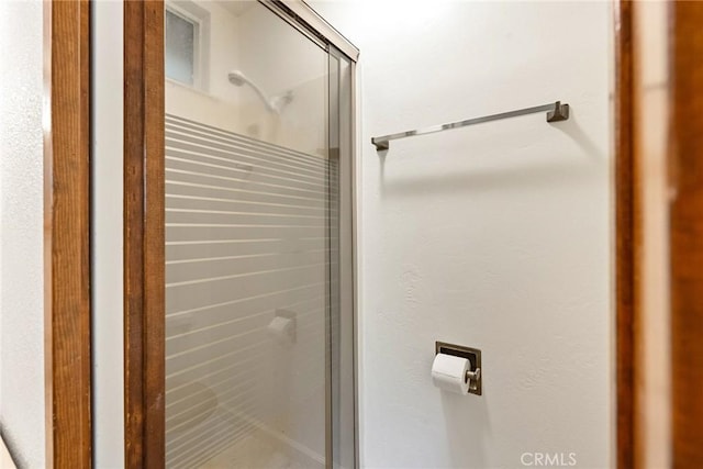 full bathroom featuring a stall shower