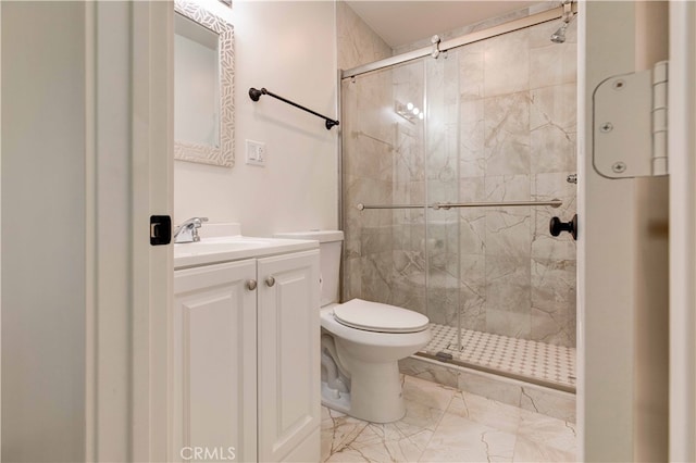 bathroom featuring vanity, toilet, and an enclosed shower