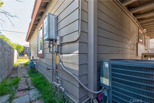 view of side of home featuring cooling unit