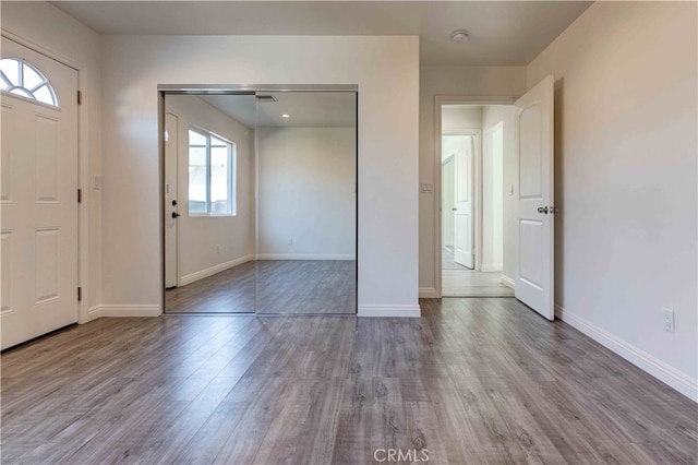 foyer entrance with light wood-type flooring