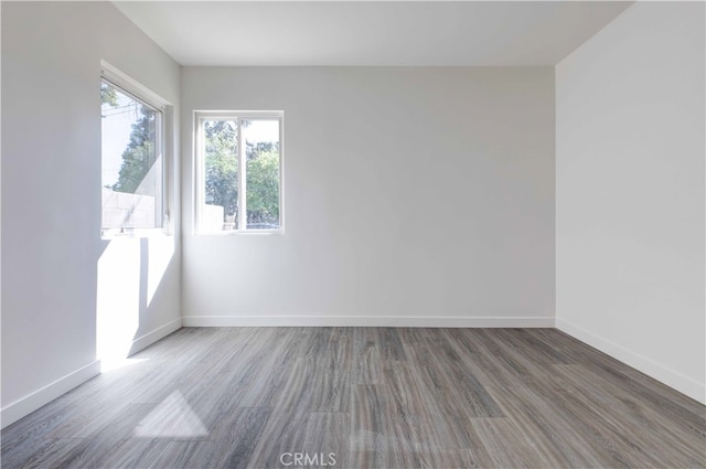 unfurnished room featuring hardwood / wood-style flooring