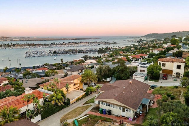 aerial view at dusk with a water view